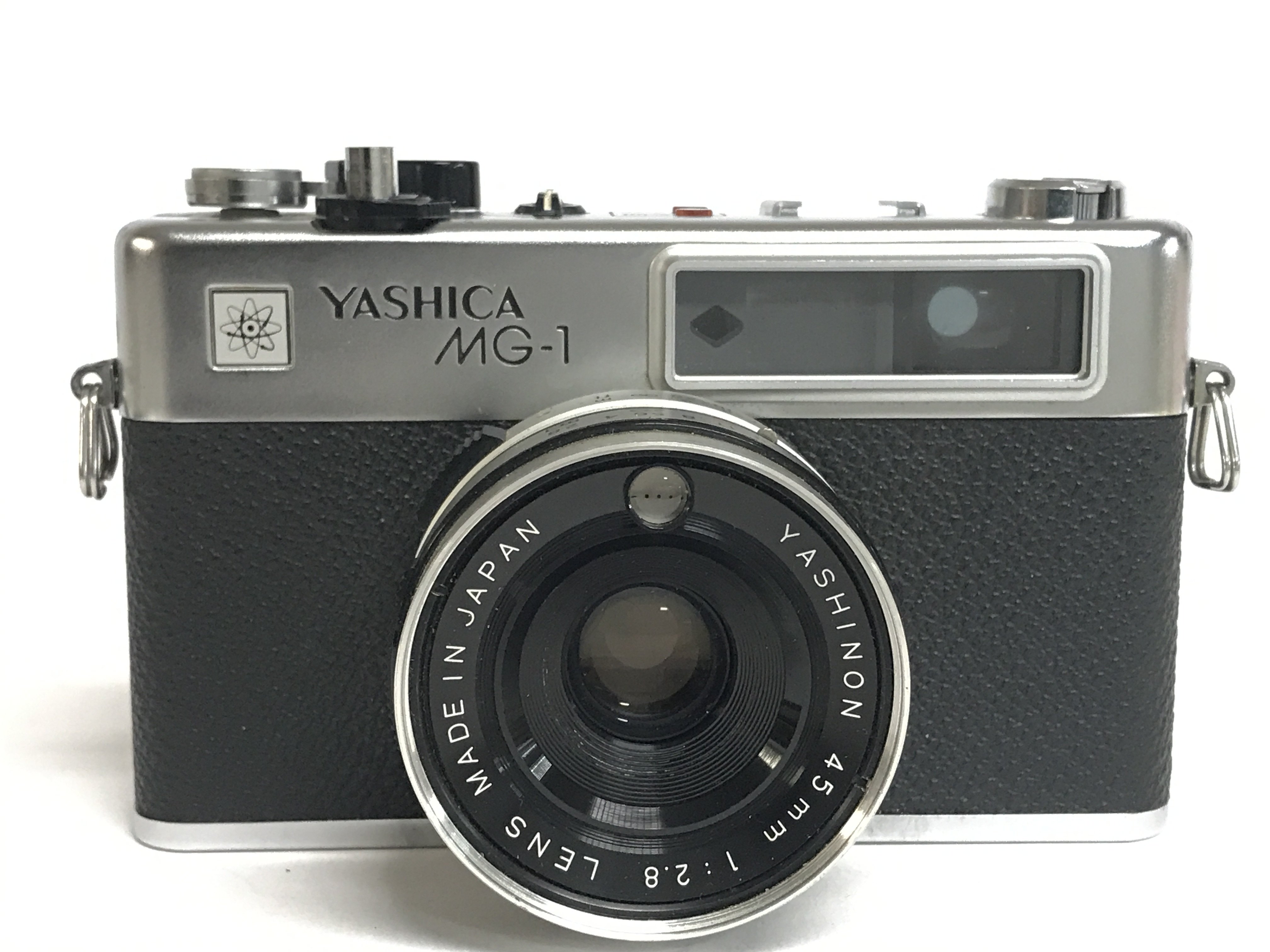 A cased Yashica MG-1 with lens. Postage category C - Bild 2 aus 4