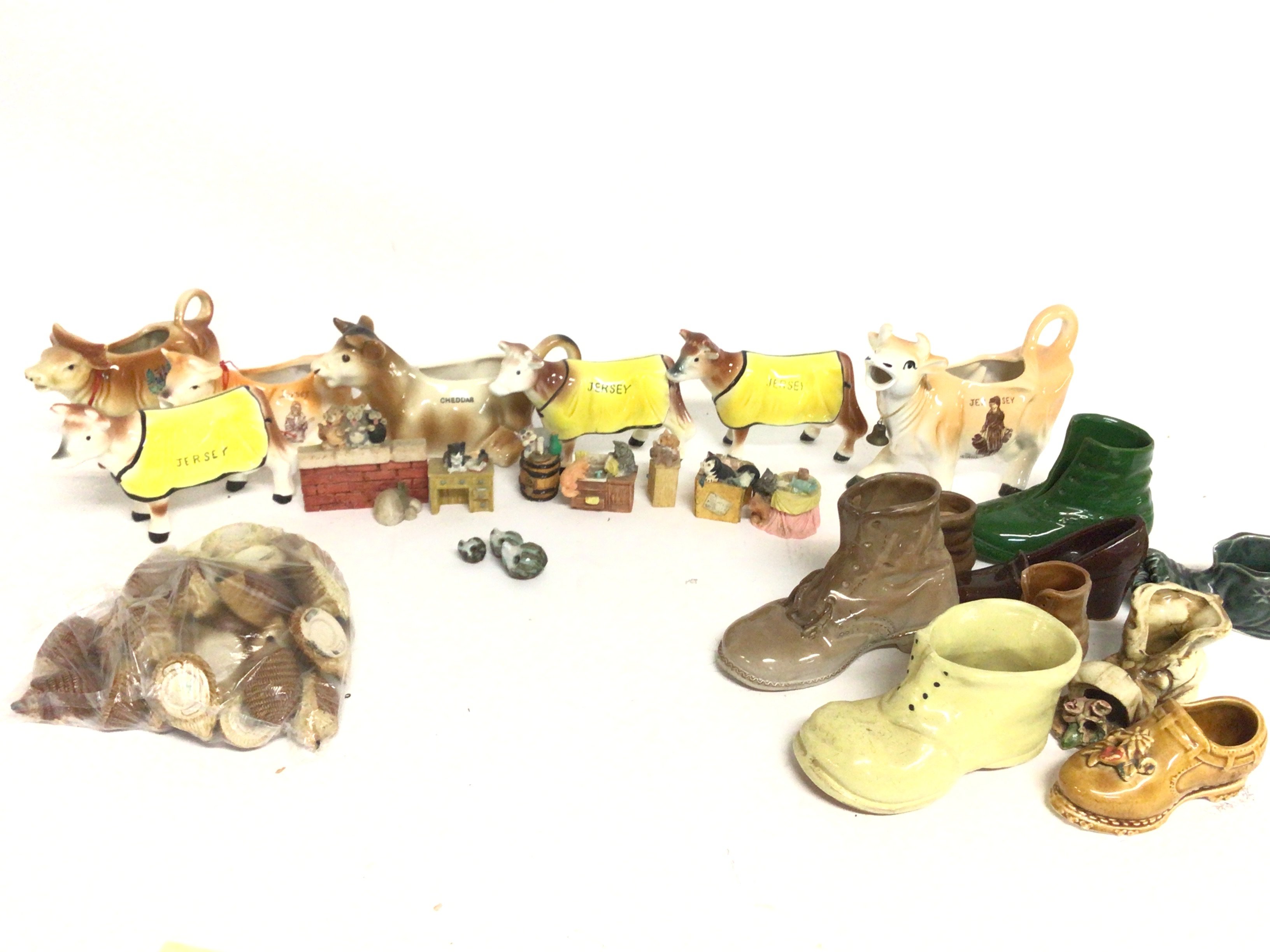 A collection of ceramics including Jersey cows, bo