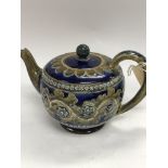 A Royal Doulton George Tinworth teapot decorated w