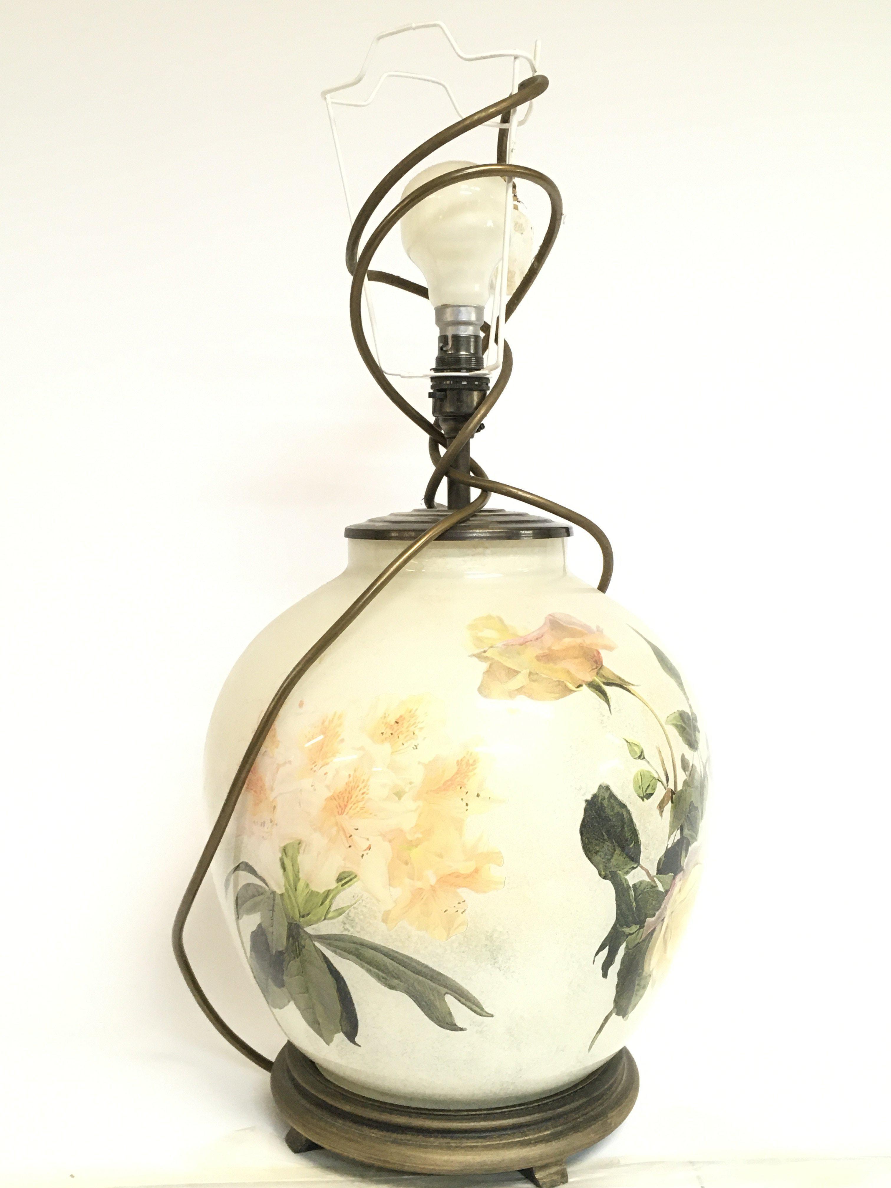 A ceramic lamp with floral design. No reserve. App