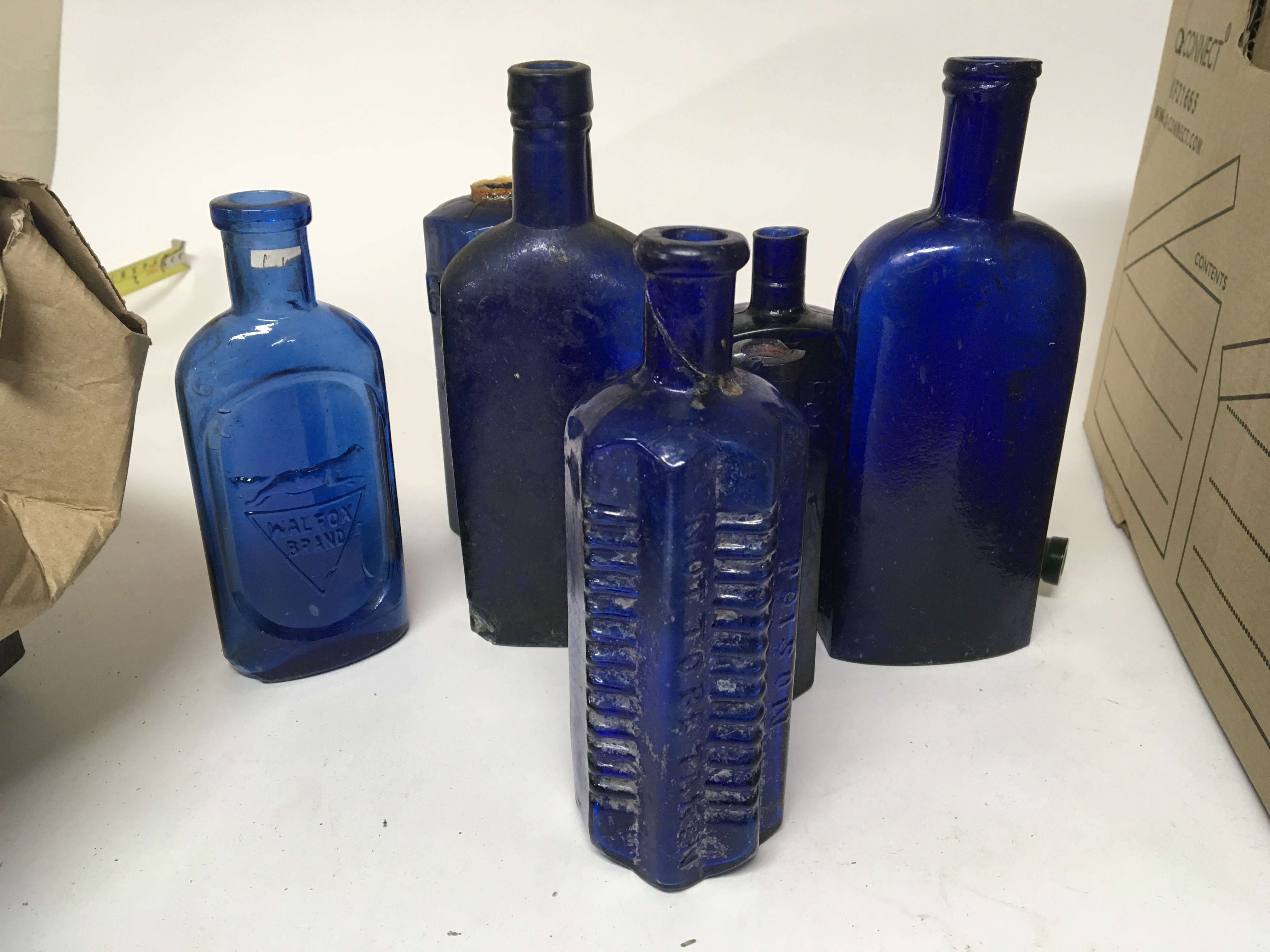 A good collection of antique Blue glass Poison bot