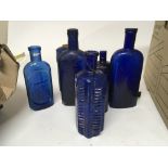 A good collection of antique Blue glass Poison bot