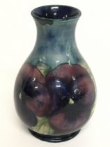 A Moorcroft vase, 12cm tall. No obvious damage or