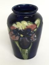 A small Moorcroft vase, 9.5cm tall. No obvious dam