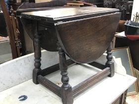 An oak drop leaf table , dimensions 25x56x44cm