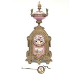 A 19th century ornate gilt spelter clock with porc