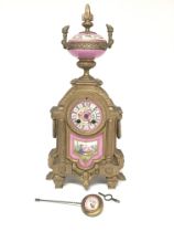 A 19th century ornate gilt spelter clock with porc