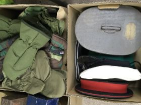 A collection of military hats a Vintage hat box an