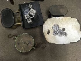 Two scales one with weights and a vintage advertis