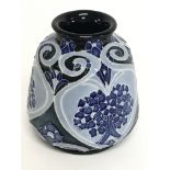 A Moorcroft forget me not vase, 8cm tall. No obvio