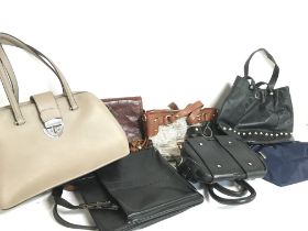 A collection of designer handbags to include the B