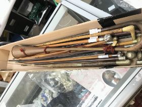 A collection of military swagger sticks riding cro