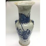 A blue and white vase decorated with warriors on h