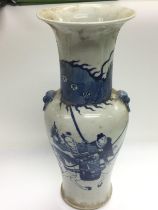 A blue and white vase decorated with warriors on h
