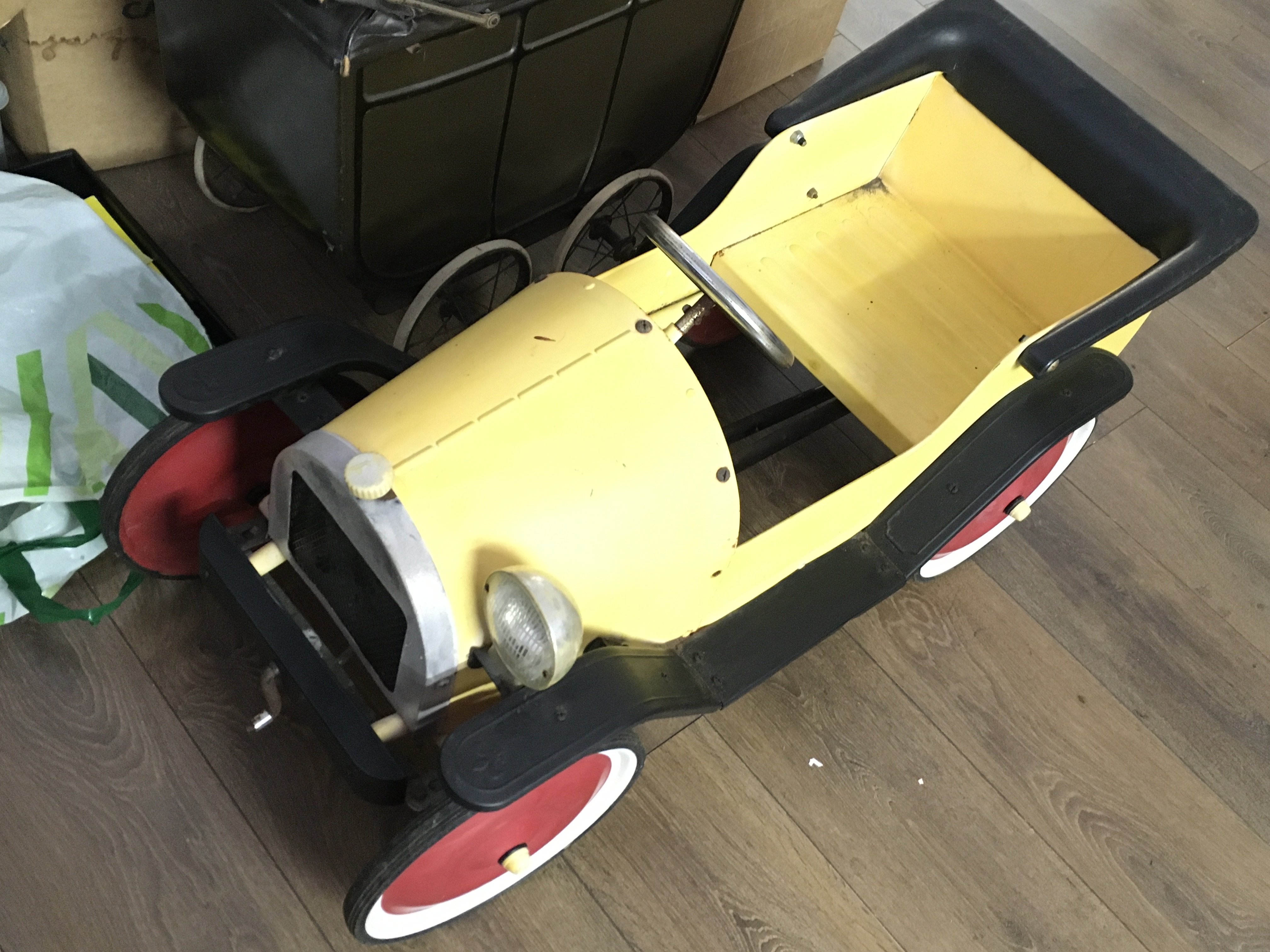 A vintage childrens Pedal car, 90cm long.