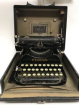 A corona typewriter and a set of gold weighing sca