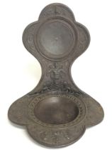 A cast iron pocket watch holder made by A. Meves B