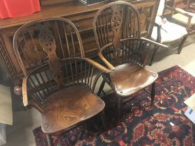 A pair of 19th century Windsor armchairs , most po