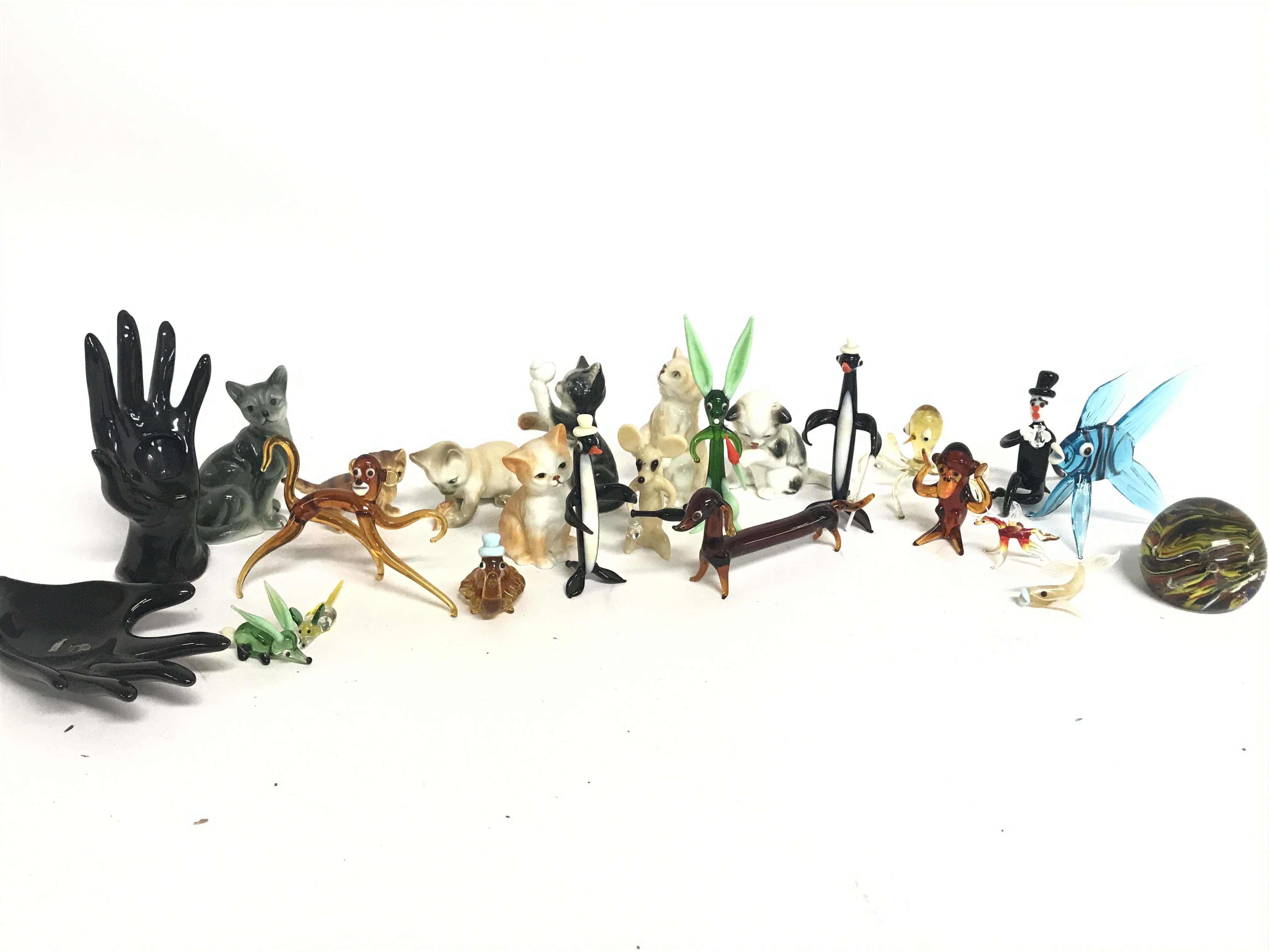 A Collection of miniature art glass figures and po