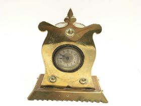 An arts and crafts brass and copper clock. 20cm ta