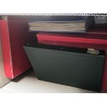 A box containing a quantity of red albums containi