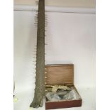 A Sawfish rostrum length 136cm and a box containin