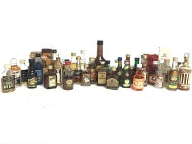 A Collection of whisky miniatures including Grandy