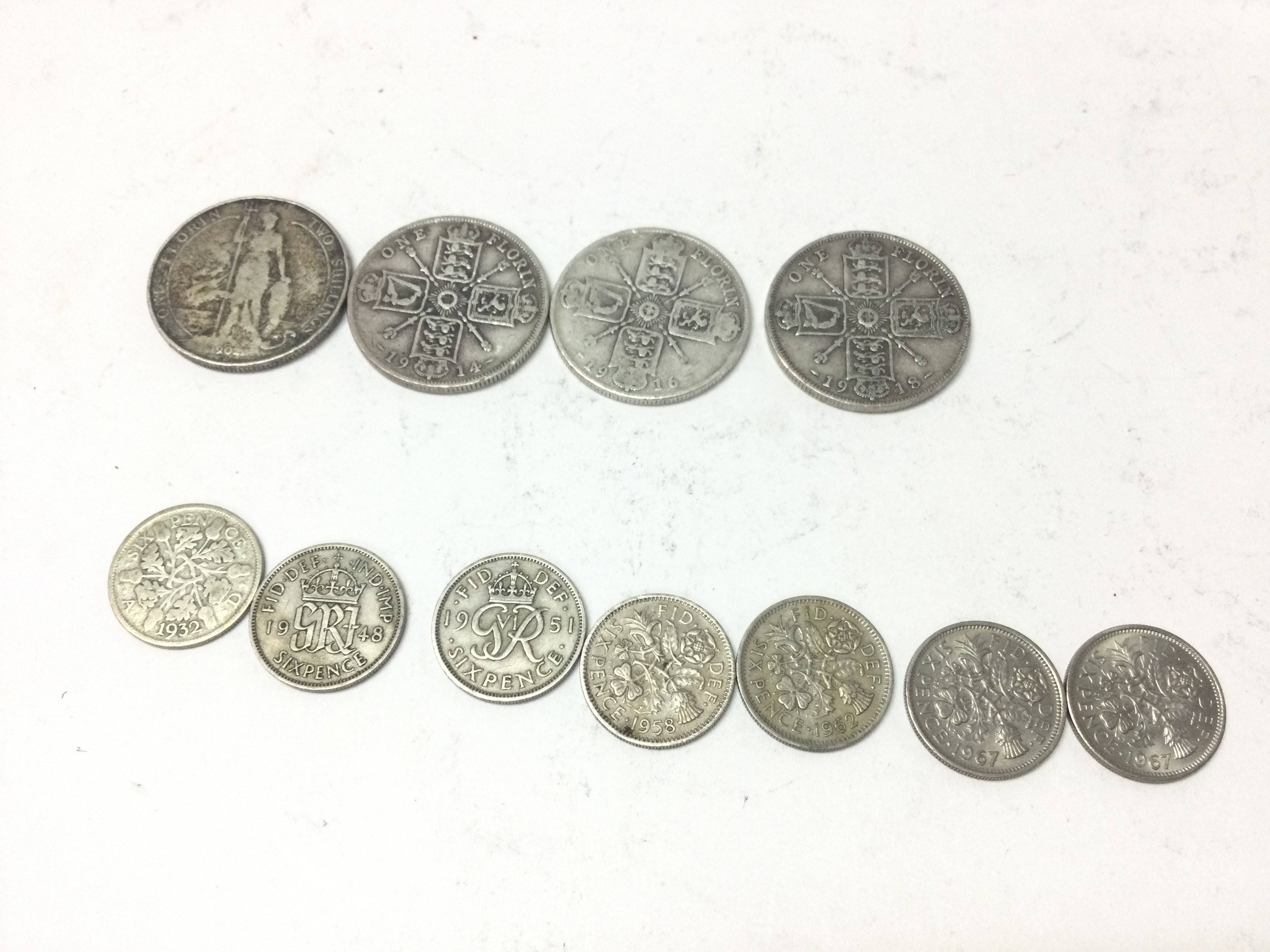 A collection of four florin coins including a 1902