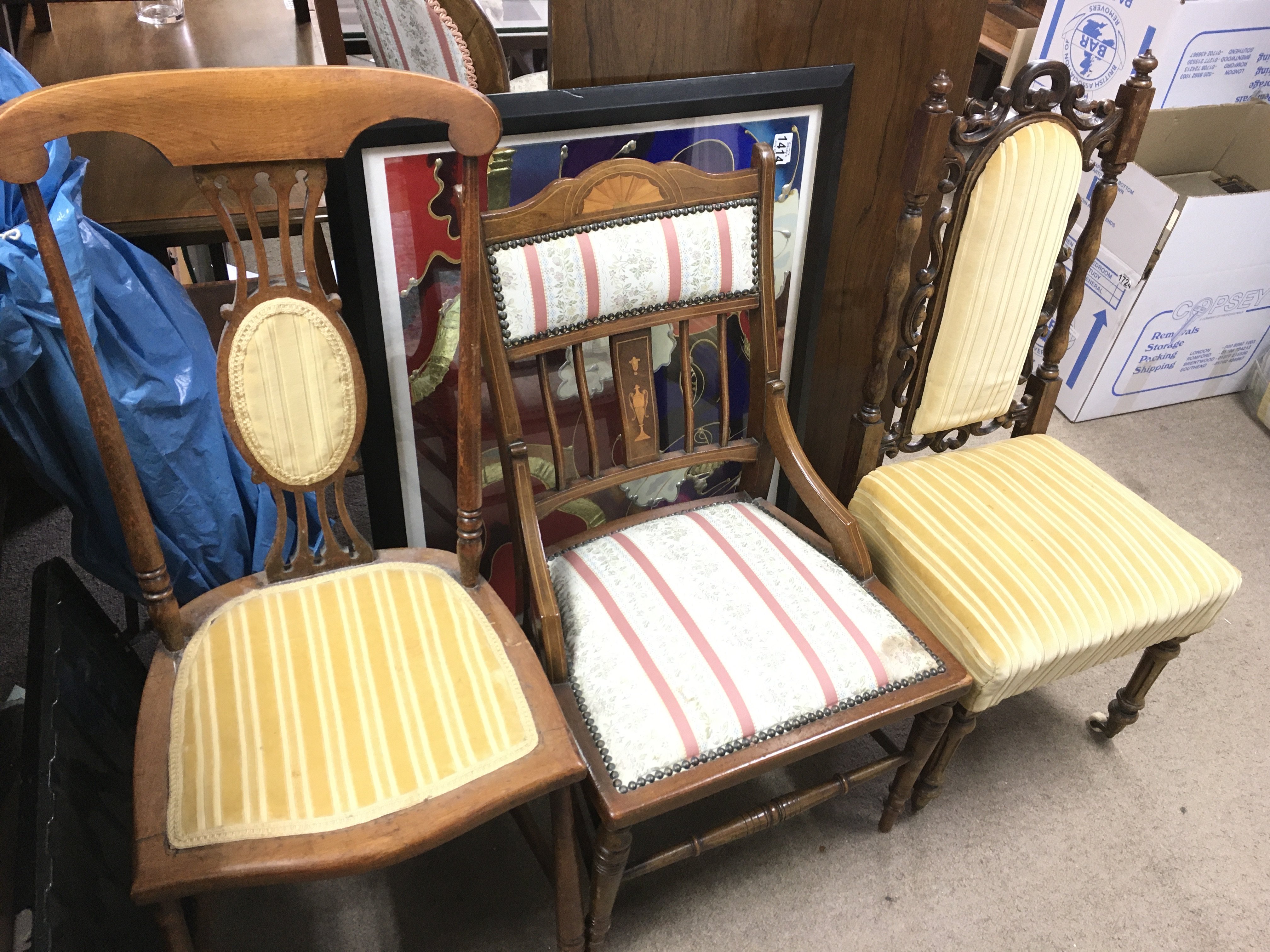 A Victorian oak chair and two Edwardian chairs.