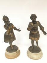 A pair of gilded and partially silvered late Victorian figures of onyx bases height 29cm