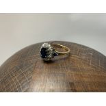 WITHDRAWN -A 9ct gold sapphire and diamond cluster ring, Size