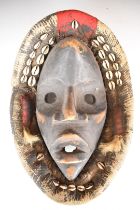 19th / 20thC African carved tribal mask, Dan tribe, Ivory Coast / Cote D'Ivoire, with shell and