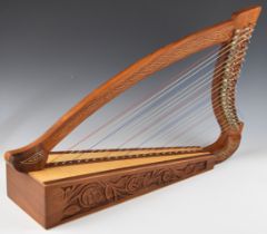 Twenty two string harp with carved decoration and painted Celtic pattern, height 91cm, in soft carry