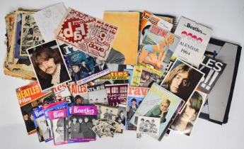 A collection of Beatles ephemera including Christmas 1964 programme, 1965 tour programme with