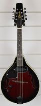 Godman eight string left handed electro-acoustic mandolin with burgundy finish, in fitted hard case,
