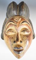 19th / 20thC African carved tribal mask, Punu tribe, Gabon, 35cm tall.