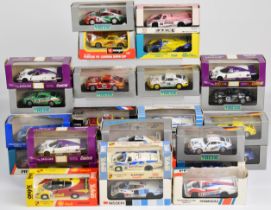 Twenty six diecast model racing cars relating to Le Mans and The Porsche Carrera Cup,