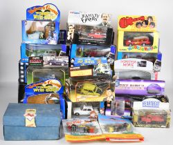 Twenty four TV and film related diecast model cars to include The Blues Brothers, Charlies Angels,