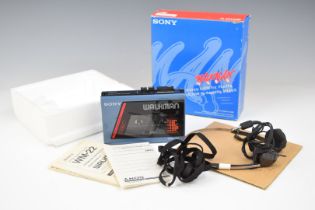 Sony Walkman WM-22 stereo cassette player, in original box with headphones and instruction manual
