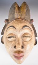 19th / 20thC African carved tribal mask, Punu tribe, Gabon, 35cm tall.