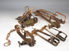 Six various animal traps including some named examples, largest 30cm long.