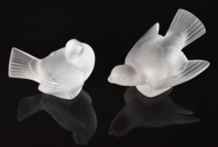 Two Lalique frosted glass sparrow paperweights, each signed 'Lalique France', largest 13cm long.