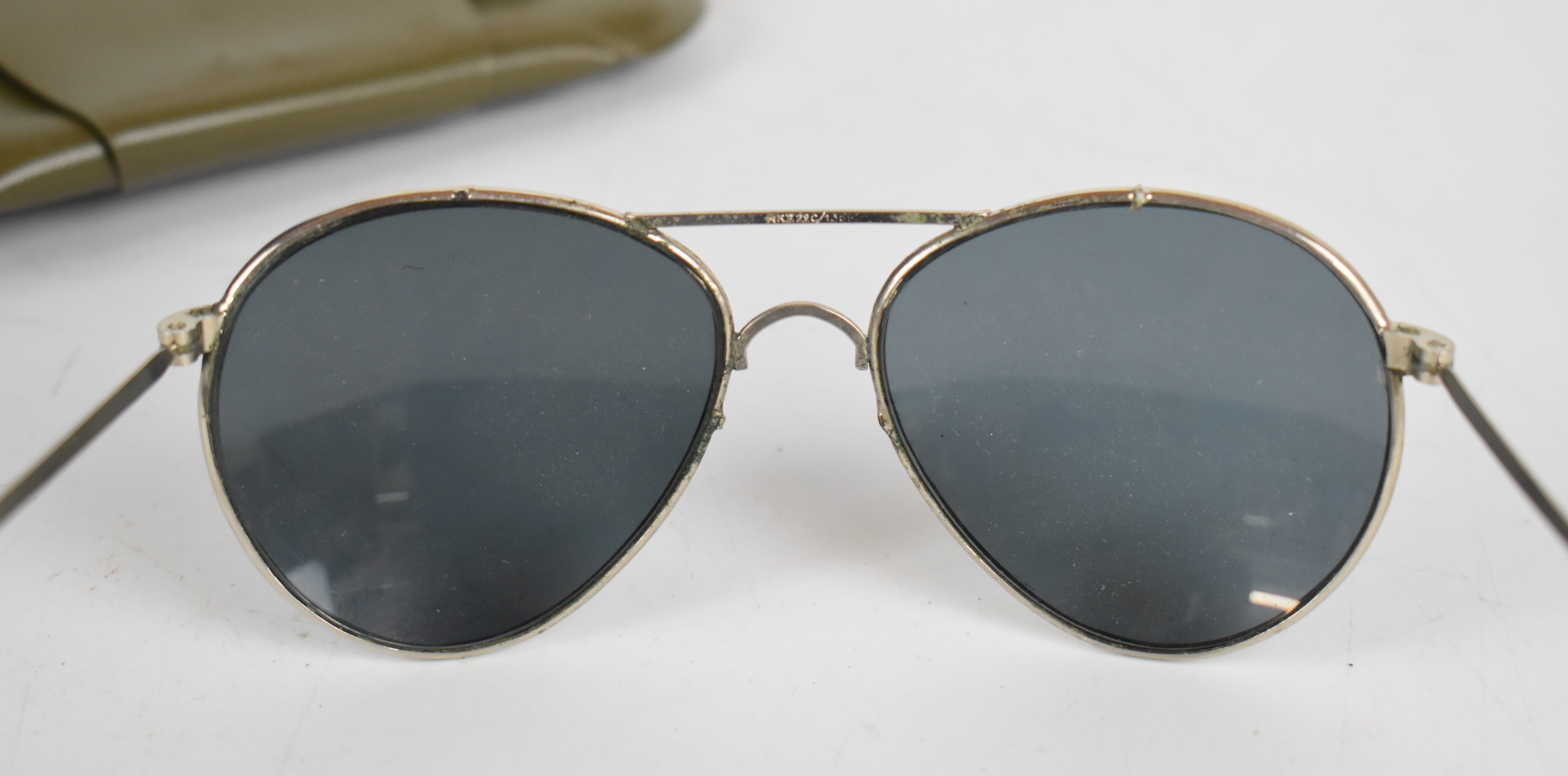 Two pairs of US military sunglasses, in original pouches, dated 1972