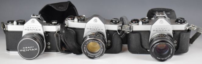 Three Pentax SP1000 35mm SLR cameras, one with 1:1.8/55 and two with 1:2/55 lens