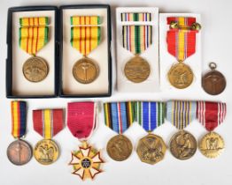 Twelve United States of America medals including Legion of Merit, Airman's Medal, Expeditionary