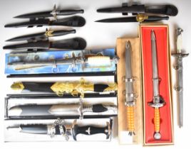 Ten replica knives / daggers including Fairbairn Sykes and Nazi examples, all with sheaths, some