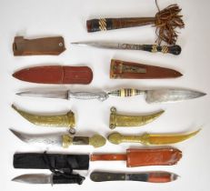 Collection of seven knives, two tribal / oriental examples, two Jambaya style, two throwing knives
