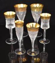 Six Moser Splendid pattern wine glasses and champagne flutes, each with cut body and stem and gilt