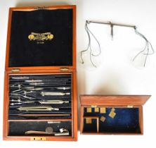 Negretti and Zambra mahogany cased drawing set and a 19thC set of travelling scales with weights, in