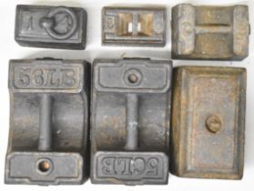 Six cast iron weights, including two 56lb examples and one dated 1771